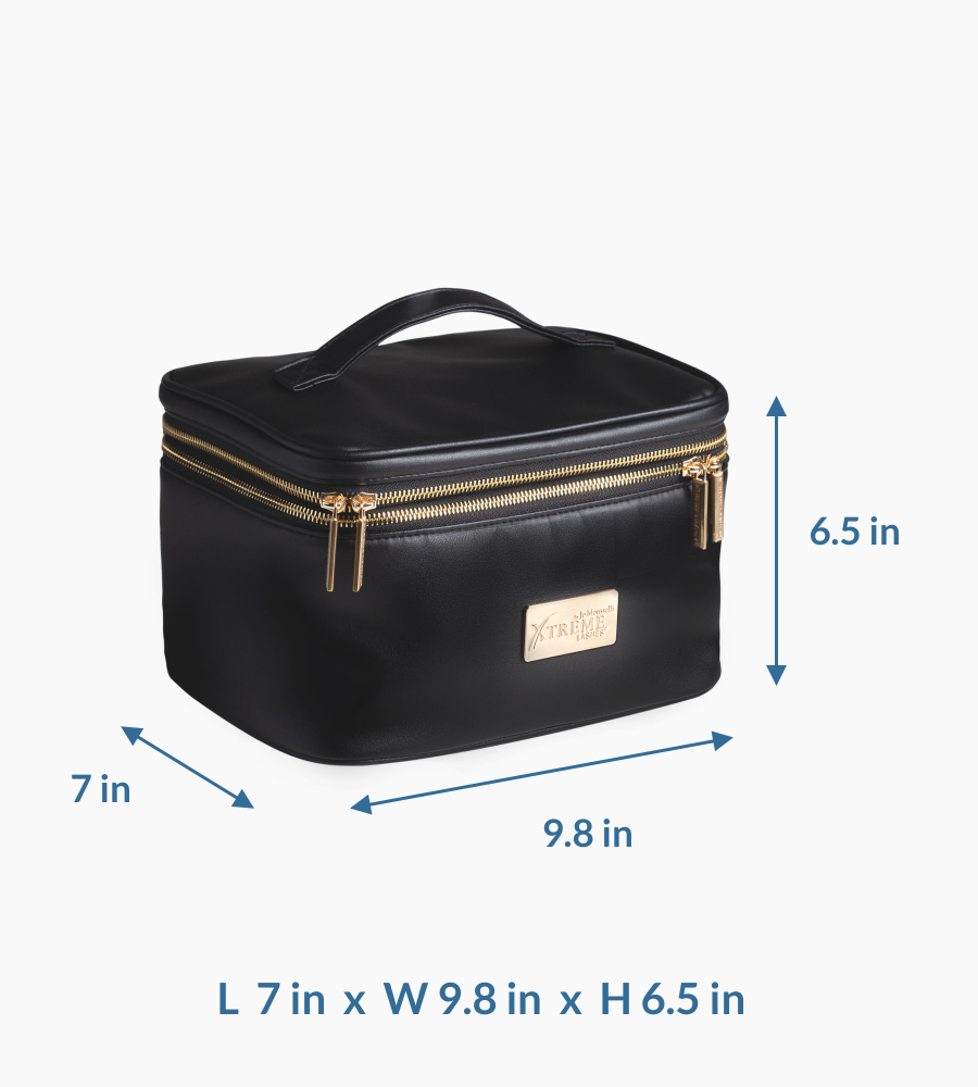 The black Xtreme Lashes Classic Carry-All cosmetic case is shown closed and viewed from a three-quarter angle. It displays the top handle, gold-colored double zippers, and the metal Xtreme Lashes logo plaque on the front.